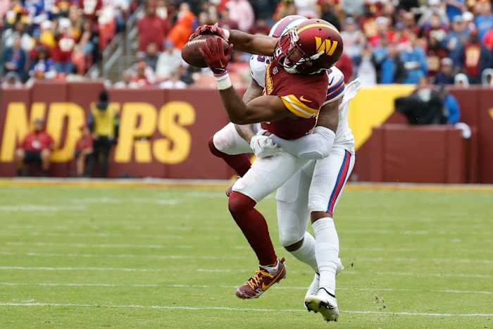 Sep 24, 2023; Landover, Maryland, USA; Washington Commanders cornerback Kendall Fuller (29) intercepts a pass intended for Buffalo Bills wide receiver Gabe Davis (13) at FedExField. Mandatory Credit: Geoff Burke-USA TODAY Sports